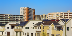 A Japanese urban neighborhood with both apartment buildings and detached houses. The diverse residential landscape reflects the varied contexts researchers encounter during home visit studies in Japan.