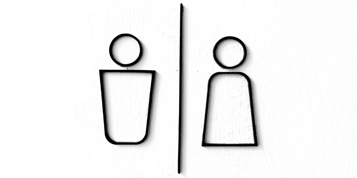 Minimalist black line icons of male and female restroom symbols on a white background, separated by a vertical line.