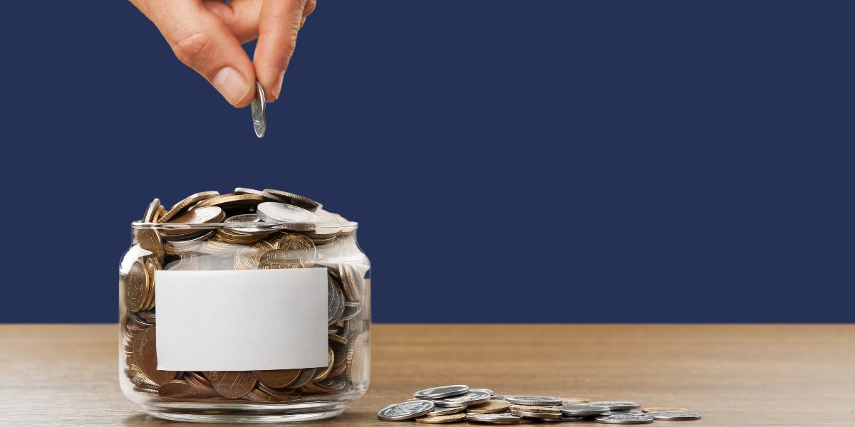 A coin being dropped into a jar full of coins, symbolizing ongoing support and participation—echoing the digital gift-giving culture found in Japan's Oshikatsu community.